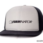 A black and white cap with foaminator label