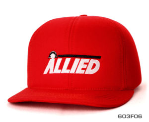 A bright red cap with an allied white label