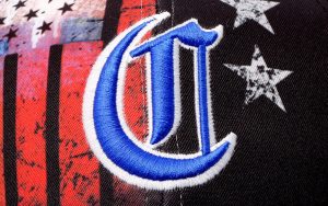 A Logo Embroidered in Blue and White Color