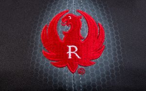 An Eagle Embroidered in Red Color With R Letter