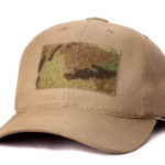 A plain brown tactical cap with a camo velcro