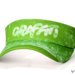 A bright neon green graffiti sports cap