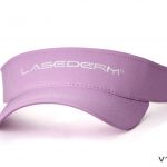 A lavender lasederm sports visor cap