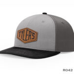Gray cap with "Tyler's" logo and black brim.